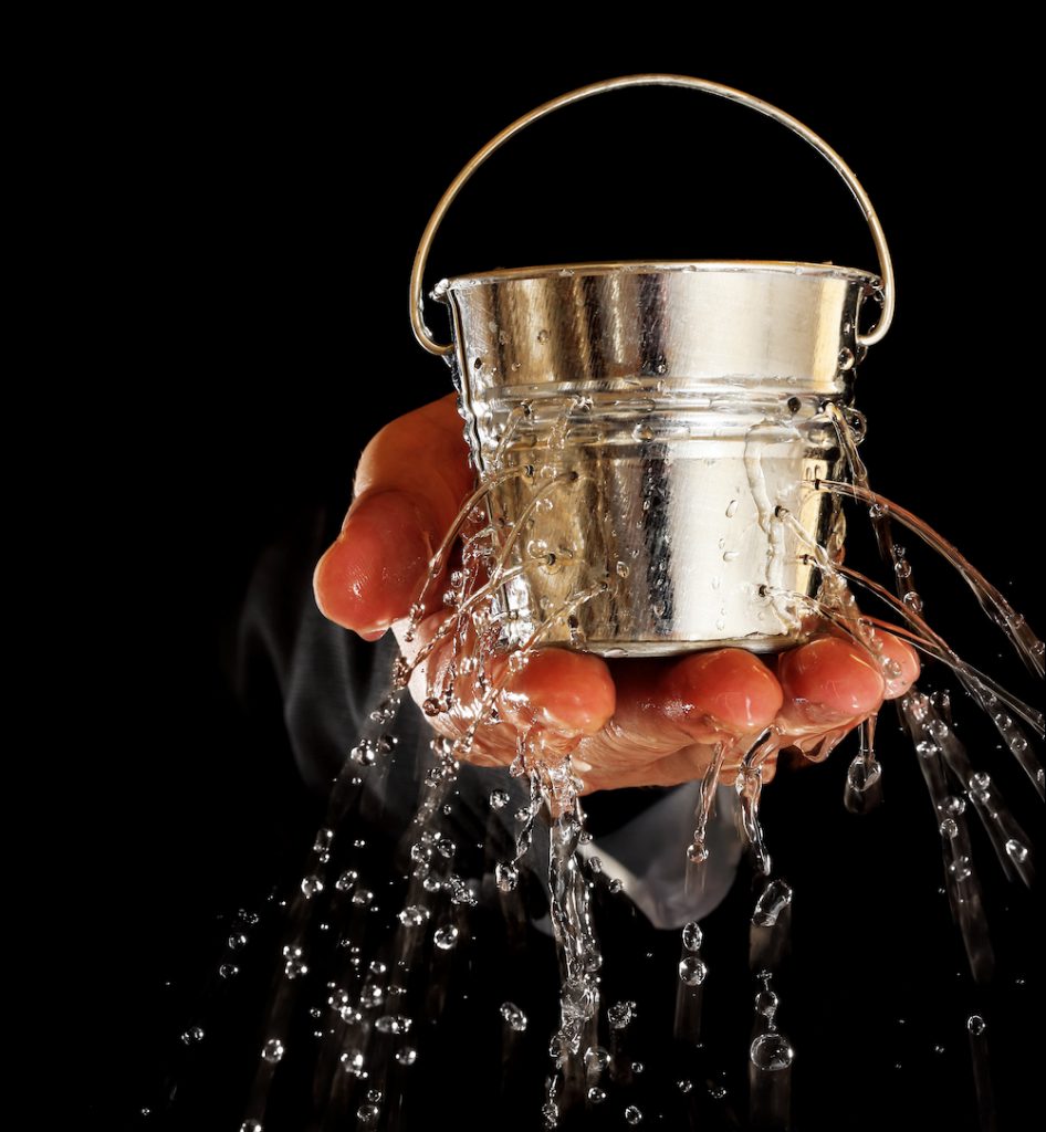 leaky bucket in a hand - conversion